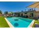 Beautiful backyard pool area with a clear blue pool and lush green turf at 4932 E Kathleen Rd, Scottsdale, AZ 85254