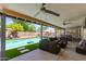 Relaxing outdoor pool area with comfortable lounge seating and lush green surroundings at 4932 E Kathleen Rd, Scottsdale, AZ 85254