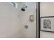Modern shower stall with stylish white tiling and convenient shower fixture at 4932 E Kathleen Rd, Scottsdale, AZ 85254