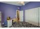 Well-lit bedroom with a study area and closet space, offering a functional and comfortable living space at 5952 E Phelps Rd, Scottsdale, AZ 85254