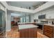 A kitchen with stainless steel appliances and a kitchen island next to the dining room area at 5952 E Phelps Rd, Scottsdale, AZ 85254