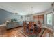 A shared living space with an area rug, a dining area and a living room area at 5952 E Phelps Rd, Scottsdale, AZ 85254