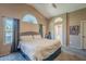 Bright main bedroom features vaulted ceilings, carpet flooring, large windows, and neutral wall color at 5952 E Phelps Rd, Scottsdale, AZ 85254