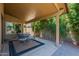 Relaxing covered patio with outdoor dining set and access to yard at 5952 E Phelps Rd, Scottsdale, AZ 85254