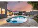 Relax in this large backyard featuring a sparkling pool and shaded seating, perfect for entertaining at 6746 E Monterosa St, Scottsdale, AZ 85251