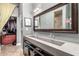 Bathroom with a floating double sink vanity, and access to the shower and walk-in closet at 6746 E Monterosa St, Scottsdale, AZ 85251