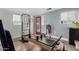 Home exercise room featuring modern equipment, recessed lighting, a red door, and a bright window at 6746 E Monterosa St, Scottsdale, AZ 85251