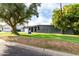 Modern home showing well-manicured lawn, mature trees, and stylish curb appeal in a serene neighborhood setting at 6746 E Monterosa St, Scottsdale, AZ 85251