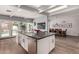 Open kitchen and dining area with a large island sink, stainless steel appliances, and modern decor at 6746 E Monterosa St, Scottsdale, AZ 85251