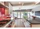 Bright kitchen with white cabinets, island sink, backyard view, and stainless steel appliances, perfect for entertaining at 6746 E Monterosa St, Scottsdale, AZ 85251