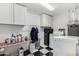 A functional laundry room features checkerboard floors, white appliances, and ample storage for convenience at 6746 E Monterosa St, Scottsdale, AZ 85251