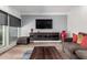 Modern living room with gray walls, media center, and hardwood floors at 6746 E Monterosa St, Scottsdale, AZ 85251