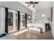 Sunlit bedroom with vaulted ceiling, French doors, and neutral decor, offering a tranquil retreat at 6746 E Monterosa St, Scottsdale, AZ 85251