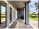 Stylish porch featuring sleek columns, large windows, and inviting curb appeal, perfect for enjoying outdoor living at 6746 E Monterosa St, Scottsdale, AZ 85251