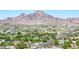Panoramic aerial view of a city and mountain range, displaying lush greenery and a thriving community at 6819 N 10Th Pl, Phoenix, AZ 85014