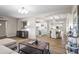 Open living space with wood-look floors, a view of the dining room and kitchen at 6819 N 10Th Pl, Phoenix, AZ 85014
