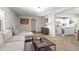 Cozy living room with wood-look floors and open layout to the kitchen at 6819 N 10Th Pl, Phoenix, AZ 85014