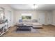 Comfortable living room with an area rug, neutral colors, and natural light at 6819 N 10Th Pl, Phoenix, AZ 85014