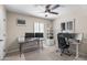 Versatile office space with neutral walls, ceiling fan, bright windows, and multiple workstation setups at 6819 N 10Th Pl, Phoenix, AZ 85014