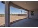 Covered patio provides a relaxing outdoor space overlooking the expansive dirt backyard at 7944 W Griswold Rd, Peoria, AZ 85345