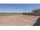 Expansive dirt backyard with view to the surrounding community at 7944 W Griswold Rd, Peoria, AZ 85345