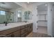 Bathroom features double sink vanity, walk-in closet, and glass enclosed shower at 7944 W Griswold Rd, Peoria, AZ 85345