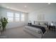 Bright bedroom with large windows, plush carpeting, and stylish decor at 7944 W Griswold Rd, Peoria, AZ 85345