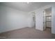 Bedroom features carpet, recessed lighting, and doorway to bath at 7944 W Griswold Rd, Peoria, AZ 85345