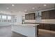 Bright and airy kitchen with white countertops, stylish cabinets, and recessed lighting at 7944 W Griswold Rd, Peoria, AZ 85345