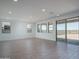 Bright, airy living room with a sliding glass door for indoor-outdoor flow at 7944 W Griswold Rd, Peoria, AZ 85345
