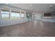 Bright and airy living room featuring tile floors, and large windows at 7944 W Griswold Rd, Peoria, AZ 85345