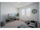 Cozy loft area with comfortable seating, television, and plenty of natural light at 7944 W Griswold Rd, Peoria, AZ 85345