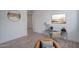 Stylish home office featuring a modern desk, decor, neutral color palette and wood-look floors at 7944 W Griswold Rd, Peoria, AZ 85345