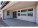 Covered patio with sliding glass door and windows, perfect for enjoying outdoor views and natural light at 7944 W Griswold Rd, Peoria, AZ 85345