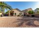 Backyard with desert landscaping, block wall, patio and covered outdoor seating at 80 W Grey Stone St, San Tan Valley, AZ 85143