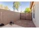 Backyard with gravel, wall and landscaping at 80 W Grey Stone St, San Tan Valley, AZ 85143