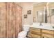 Standard bathroom with framed art, light wood cabinet, framed mirror and neutral paint at 80 W Grey Stone St, San Tan Valley, AZ 85143