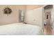 Bedroom showcasing a closet with sliding doors, window, and comfortable bed at 80 W Grey Stone St, San Tan Valley, AZ 85143