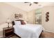 Bedroom features a ceiling fan, a large window and a comfortable queen size bed at 80 W Grey Stone St, San Tan Valley, AZ 85143