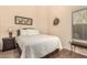 Cozy bedroom with a large bed, side table, and window for natural light at 80 W Grey Stone St, San Tan Valley, AZ 85143