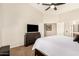 Bright main bedroom showcasing a dresser and a doorway to the bathroom at 80 W Grey Stone St, San Tan Valley, AZ 85143