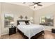 Spacious main bedroom with a ceiling fan, large windows, and neutral walls at 80 W Grey Stone St, San Tan Valley, AZ 85143