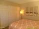 Bedroom with closet and matching nightstands, illuminated by bedside lamps and natural light at 8700 E Mountain View Rd # 2029, Scottsdale, AZ 85258