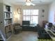Functional home office with ample storage, natural light, and comfortable seating for a productive workspace at 8700 E Mountain View Rd # 2029, Scottsdale, AZ 85258