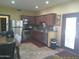Well-equipped kitchen features stainless steel appliances, dark wood cabinets and a tile backsplash at 8700 E Mountain View Rd # 2029, Scottsdale, AZ 85258