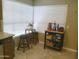 Bright kitchen area with corner table and stools, plus additional storage with metal shelving at 8700 E Mountain View Rd # 2029, Scottsdale, AZ 85258
