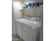 Functional laundry room equipped with a modern white washer and dryer for convenience at 8700 E Mountain View Rd # 2029, Scottsdale, AZ 85258