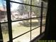 Scenic view from window overlooking the community's lush green landscape and mature trees at 8700 E Mountain View Rd # 2029, Scottsdale, AZ 85258