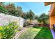 Lush backyard featuring colorful flowers, mature trees, a well-manicured lawn, and tranquil seating area at 9115 N 101St Way, Scottsdale, AZ 85258