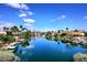 A stunning view of the community with waterfront homes and boat docks at 9115 N 101St Way, Scottsdale, AZ 85258